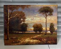 Full view of vintage signed landscape oil painting featuring trees, sky, and grassy field, showing overall condition and texture.