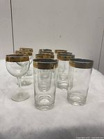 Photo of 3 wine glasses with gold-plated rims showing signs of gold wear.
