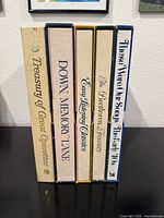 Five Reader's Digest vintage vinyl collector's edition box sets standing vertically, showing titles on box spines including 'Treasury of Great Operettas', 'Down Memory Lane', 'Easy Listening Classics', 'The Beethoven Treasury', and 'These Were Our Songs The Early 40s'. Boxes show vintage wear.