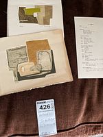 Both pressed etchings displayed alongside artist biography sheet and MaxSold tag with dimensions.