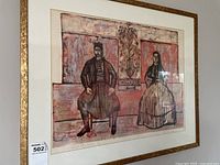 Framed serigraph of seated man and woman in gold-tone frame
