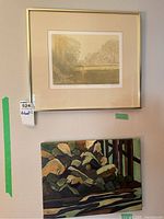 Overview of both framed artworks hanging on wall; shows relative size and frame style