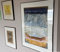 All three framed artworks on wall: large abstract acrylic painting by John William Sadler, medium abstract painting, and small etched print