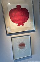 Two framed prints hanging on wall