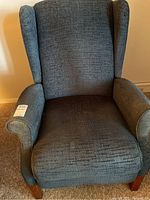 Front view of gray wingback recliner