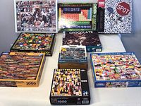 Photo showing a group of puzzle boxes arranged on a table featuring designs such as paint tubes, periodic table elements, spot the dog, chocolate, and pencils.