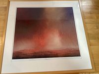 Full view of framed pastel landscape artwork in light wood frame and white mat