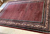 Full view of entire rug laid flat on concrete floor