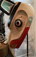 Three-quarter right profile of mask showing painted formline details