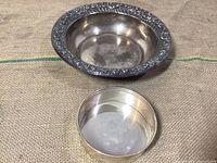 Overview of large sterling bowl and small Empire dish on burlap