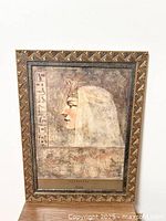 Full view of the framed Cleopatra art print in a carved wooden frame showing the complete artwork and frame condition.