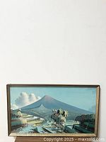 Full view of the framed oil painting showing volcano, terraces, and greenery