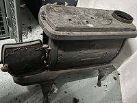 Three-quarter front view showing overall shape, loader door open