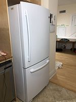 Full view of refrigerator installed in kitchen