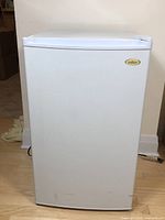 Front view of the white Salton upright freezer with visible brand logo and minor exterior wear.