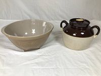 Two vintage ceramic items: Thomas Plant bowl and two-toned bean pot with lid and handles.