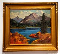 Framed oil painting showing the full view of the landscape with the vintage gold painted wood frame.
