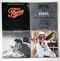 All four vinyl record album covers displayed: Fame, Evita, Billy Joel The Stranger, and Elton John's Greatest Hits.