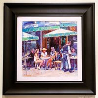 Framed oil on canvas painting showing signed colorful Paris café scene artwork with black frame and white matting.