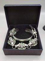 Both bracelets displayed in a black presentation box.