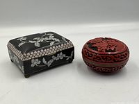 Photo of both boxes side by side showing the square cloisonne and round cinnabar lacquer box.