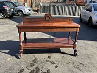 Front view of sideboard with drawers closed and shelf