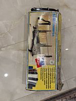 Original box of Nobex Champion miter saw showing the saw and brand details on the packaging.