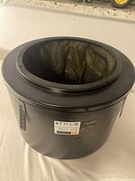 Full view of one cylindrical JBL MTC-300BB8 backbox showing foam-lined interior