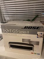 Front of the Bose 3-2-1 GS Series II DVD Home Entertainment System box showing main product image and branding.