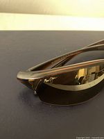 Close-up side view of Maui Jim River Jetty sunglasses showing frame and logo.