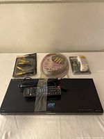 Panasonic 3D Full HD DVD player with remote, power cord, audio cables and rechargeable batteries with charger