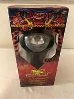 Front view of boxed Rally Hi Power Halogen Spotlight 2000 Series showing Ultra Beam System branding and product visible through clear window.