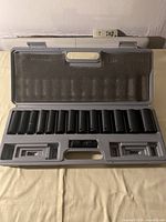 Wide view of the complete heavy duty Pittsburgh socket set in the open plastic case showing 14 deep sockets and one ratchet adapter slot.