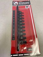 Front view of Ares Low Profile Impact Star Bit Socket Set in original packaging showing 10 black star bit sockets in varying sizes mounted on a black rail against a red background with size labels.