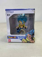 Front view of the boxed Dragon Ball Super Chibi Masters Super Saiyan Blue Gogeta figure with branding and character artwork visible.