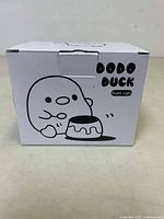 Photo of the front of the white product box showing the DoDo Duck character and product name.