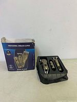 Photo of boxed set showing three professional cordless clippers with packaging.
