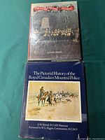 Two hardcover books with dust jackets about Royal Canadian Mounted Police, showing front covers and titles.