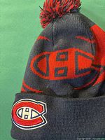 Montreal Canadiens navy blue and red knit toque with pom pom and Canadiens logo patch on cuff