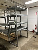 Side angle view of heavy duty storage shelf, showing metal construction and multiple shelves.
