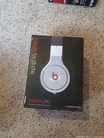 Front of the box showing Beats Pro headphones branding with image of white headphones on black background