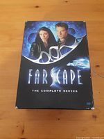Front cover of Farscape Complete Series box set showing main characters and logo.