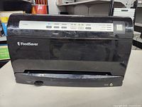 Front view of FoodSaver vacuum sealer showing the brand logo and overall unit condition.
