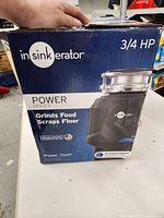 Image of the front of the InSinkErator box showing model and power details