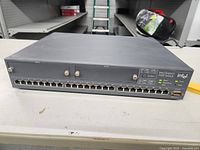 Front view of the Intel Express 510T switch showing 24 Ethernet ports and overall device condition.