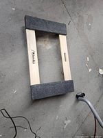 Top view of Milwaukee furniture dolly showing padded wooden frame.