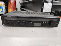 Front view of Realistic System Seven receiver showing the control knobs, input selector, and analog meter on the front panel.