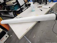 Long white Sonos soundbar on table showing full unit