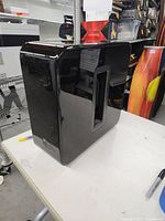 Overall view of gloss black Sonos Sub with central port and enclosure shape