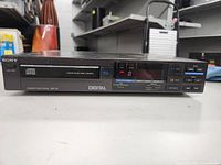 Front view of the Sony STR-DB855 digital CD player showing buttons, display, and branding